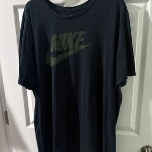 Nike Men's Black Tee with Green Logo